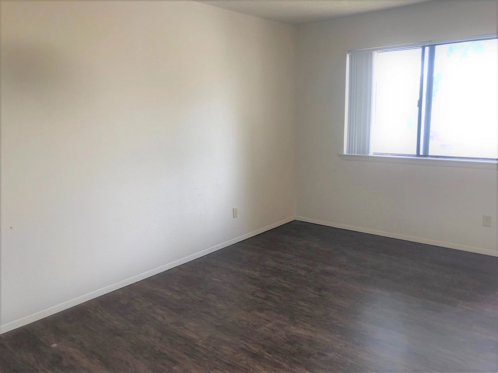 Living room with large sliding window.