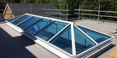White PVCu lantern skylight window on a flat roof extension