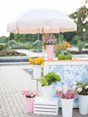 Flower cart and flowers in buckets