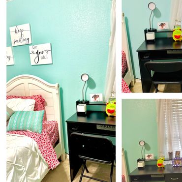 Cozy bedroom corner with a black desk, chair, and bed against aqua walls.