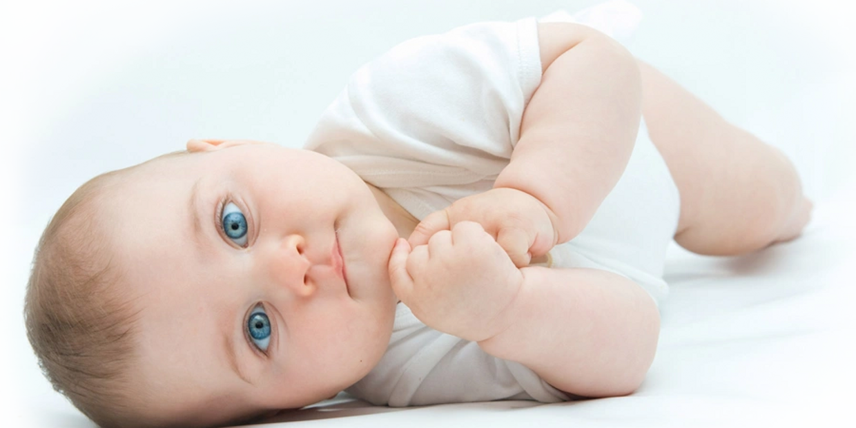 Cloth Diapers are better for your baby blue eyes lying on side