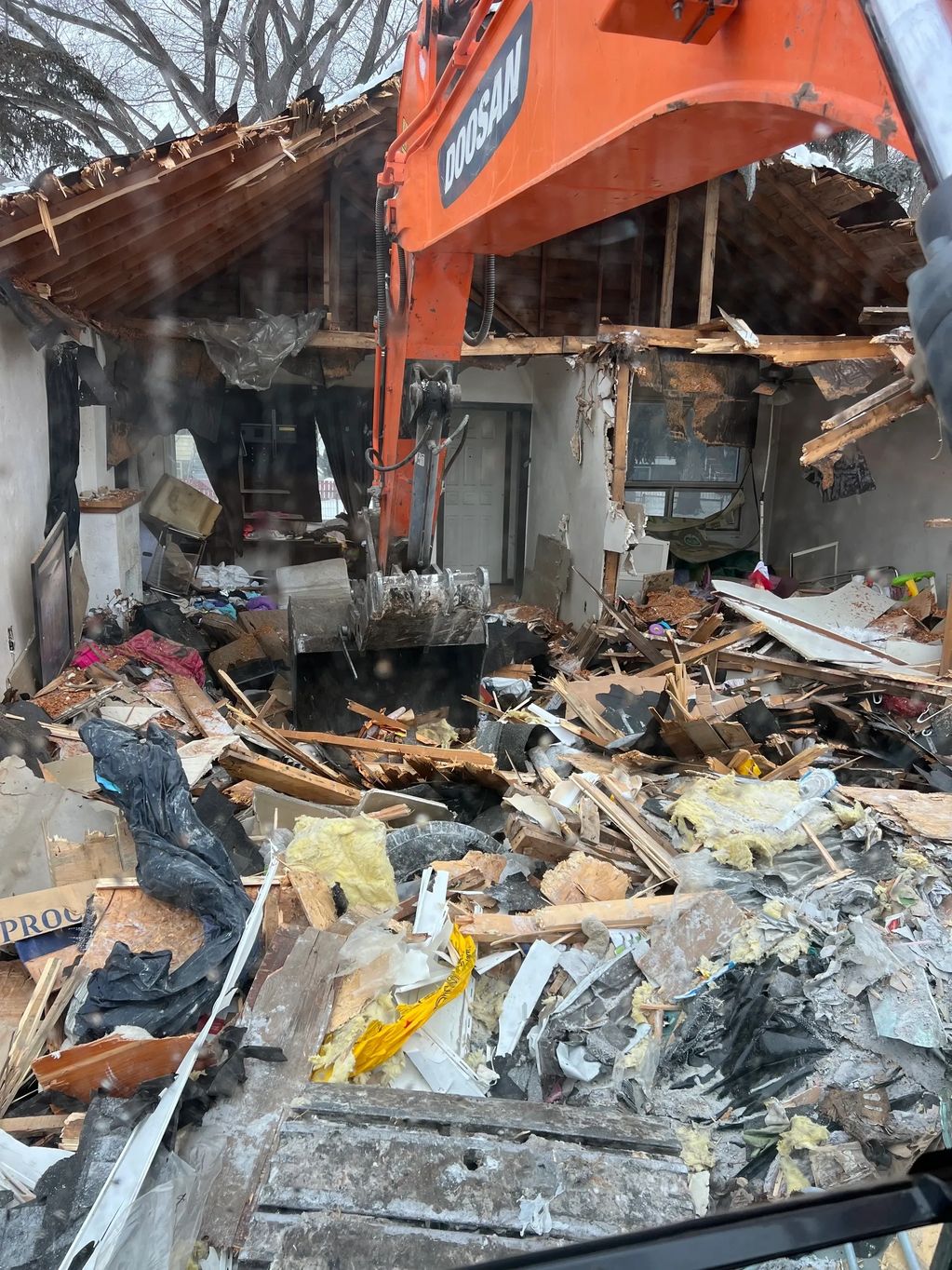 Taking down debris in a controlled fashion for Edmonton Demolition.