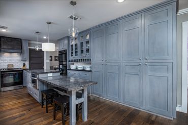 Microwave drawer, double electric ovens and wine bar.