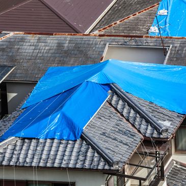 image of roof with tarp covering it
