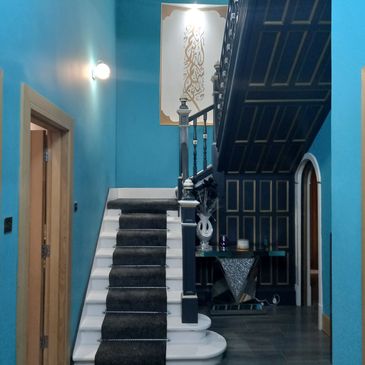 a large hall stairs and landing designed and decorsted