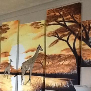 a large painting of a sunset