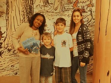 Alice posing with the children