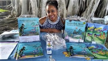Woman with books on a table