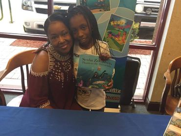 Woman and a child posing to camera