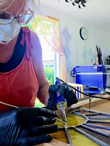 Lead soldering stained glass.