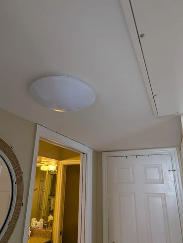 Old lighting hanging outside of bathroom