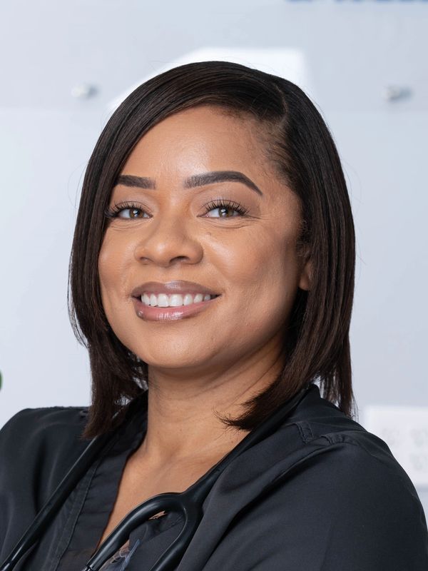 Smiling female healthcare professional with stethoscope.