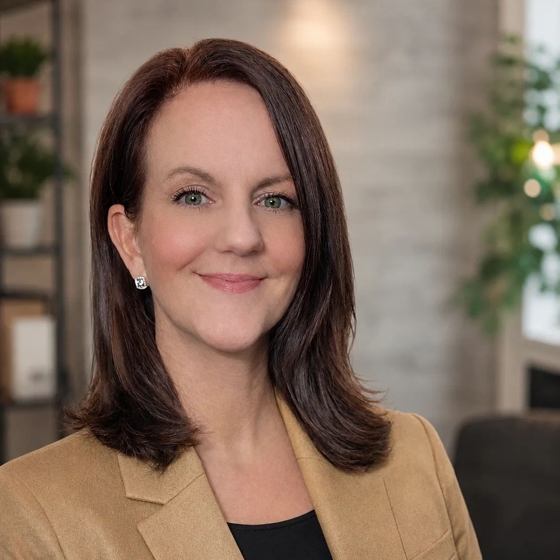 Professional woman smiling in an office setting.