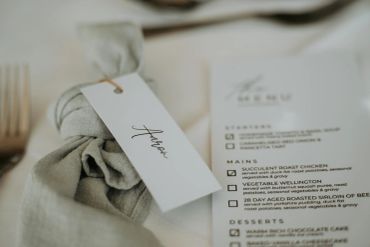 Table setting with personalized name tag and menu.