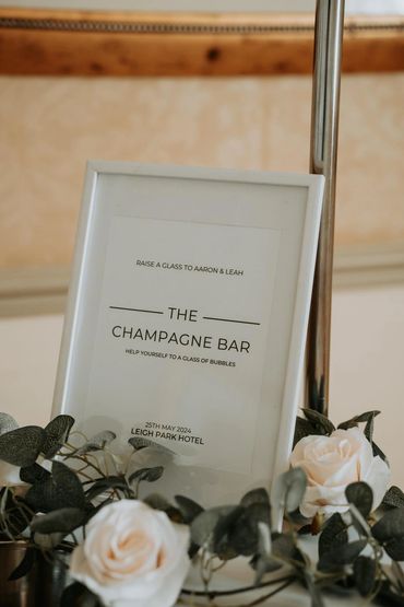 Sign for a champagne bar at a wedding.