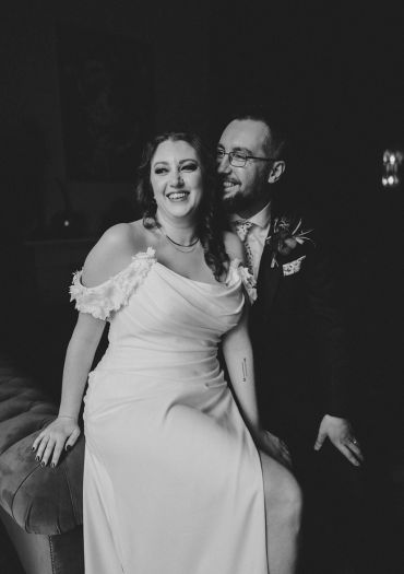 Happy couple sharing a joyful moment on their wedding day.