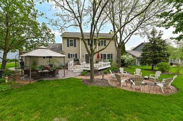 a backyard of a house with seating arrangements
