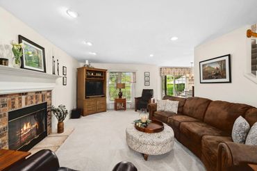 a living space with sofa, center table and more items