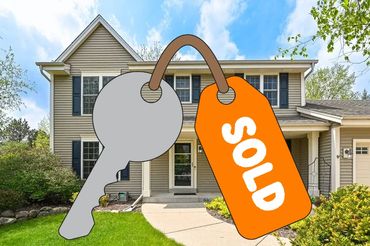 front view of a house with a garden