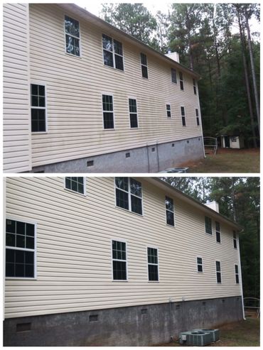 Side of dirty home cleaned with soft washing