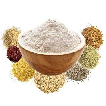 A wooden bowl of flour surrounded by different types of grains.