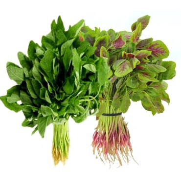 A bunch of green leafy vegetables are on the table.