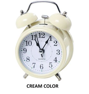 Cream-colored vintage twin bell alarm clock showing time 12:55.