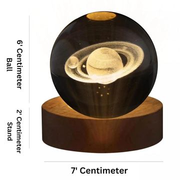 7 cm glass ball with Saturn design on a 2 cm wooden stand.