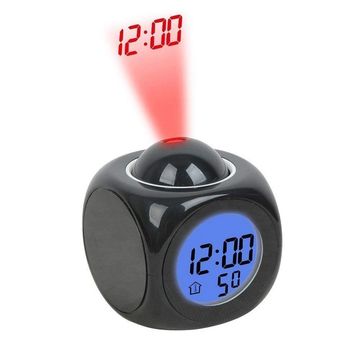 Black digital alarm clock projecting time in red light.