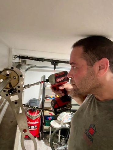 Garage door torsion spring replacement, opener motor, garage door repair in Tampa, FL