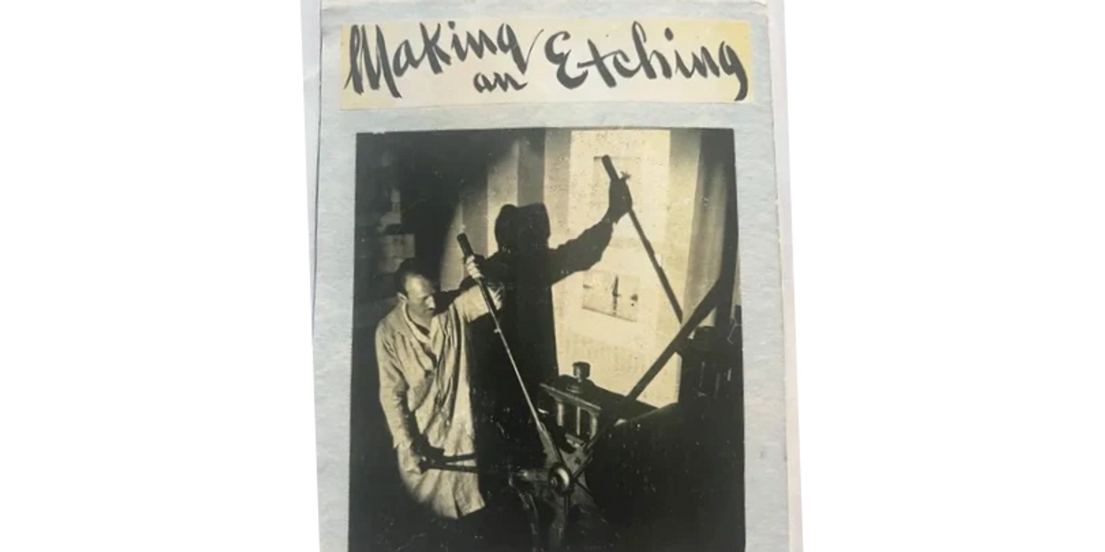 Black and white photo of a man making an etching with shadows.