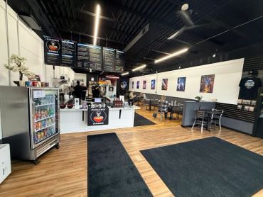 Interior of Electric Ramen restaurant with modern decor.