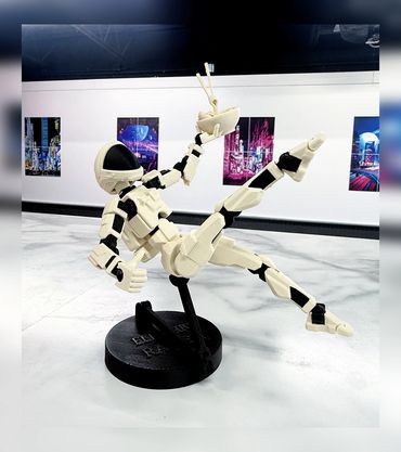 Robot figure playing with chopsticks and noodles.