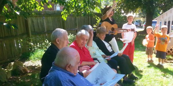 Family and friends gather for live entertainment in our backyard.