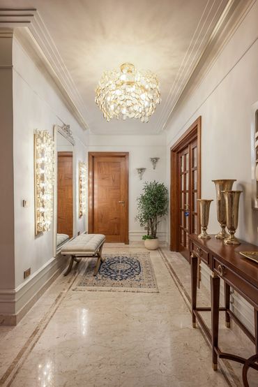 Entrance hall with brass sconces, Dokki apartment — تصميم داخلي شقق القاهرة