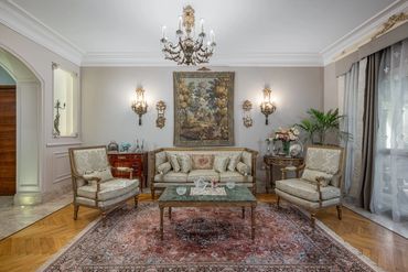 Formal salon with tapestry and antique seating — تصميم فيلات كلاسيك