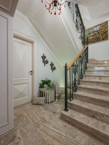 Stone staircase with wrought iron balustrade — تصميم سلالم فيلات