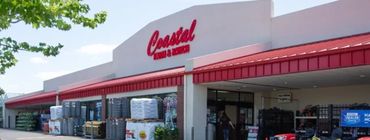 Coastal Farm & Ranch storefront with outdoor displays of supplies and products.