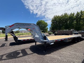 Large Horizon flatbed trailer parked outdoors.