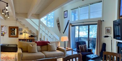 A true "Nestled in the Woods" condo. This two bedroom two bath ski in / walk out home offers all the