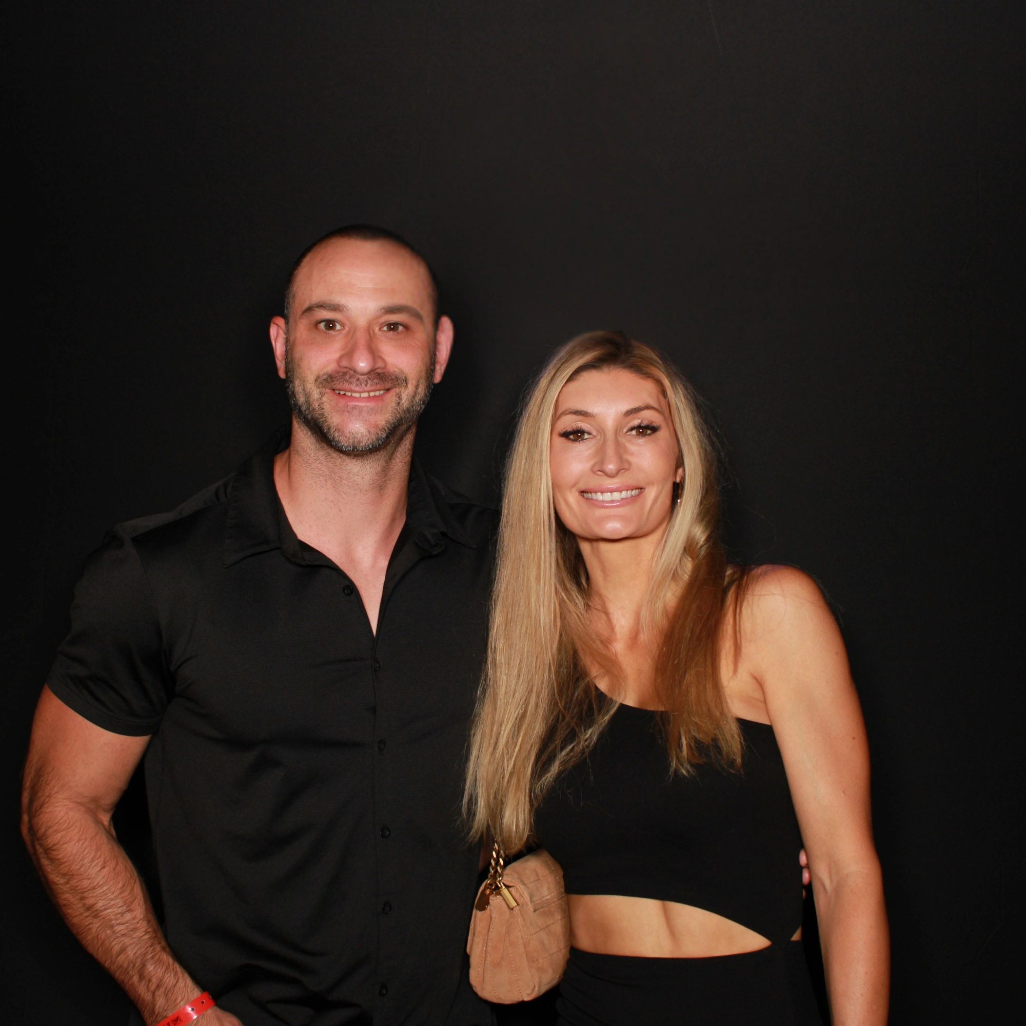 A couple poses in the photo booth at their corporate national awards ceremony in Scottsdale, AZ