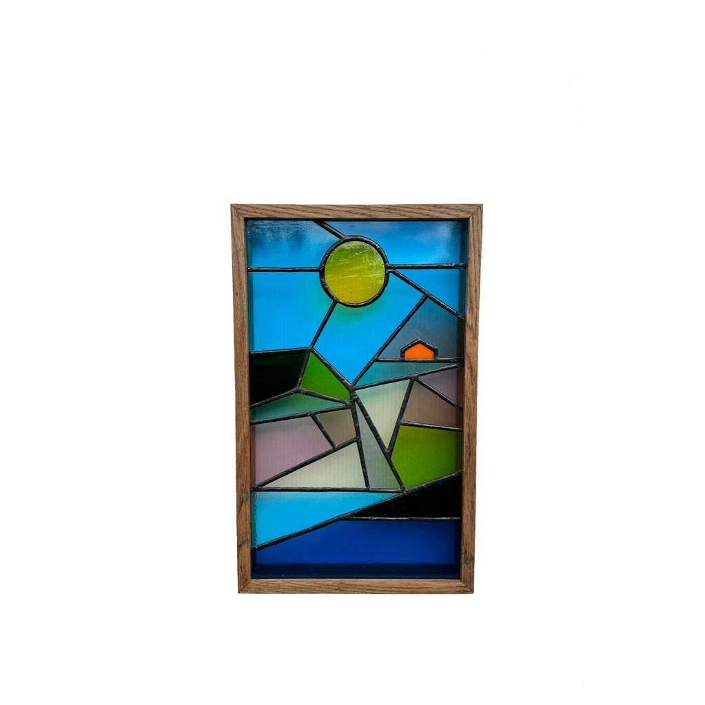Stained glass panel in oak frame