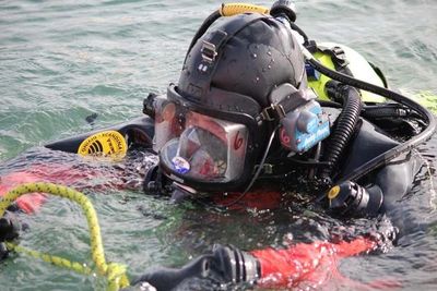 Public Safety Diver in full face mask using tether for search patterns Solomons MD
