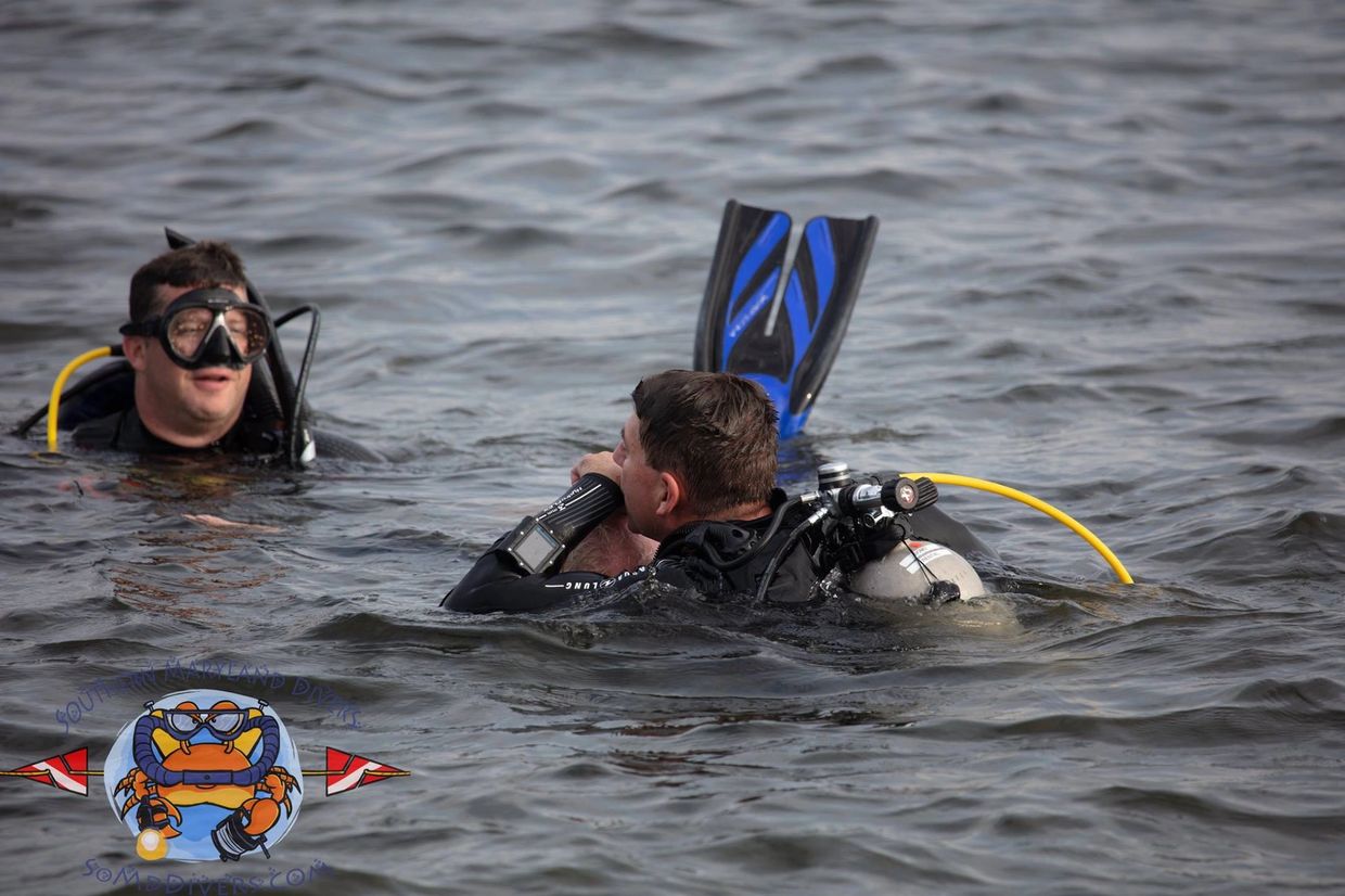 Diver providing rescue breaths during PADI Rescue Diver Course in Patxuent River in Solomons MD