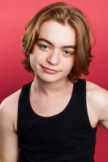 A young man with brown hair and blue eyes.