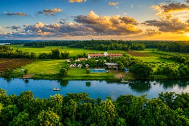 River resort in Dandeli overlooking the river, greenery and scenic sunset landscape