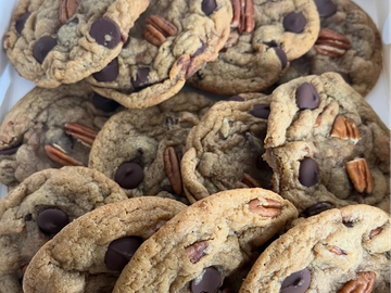 Close-up of freshly baked chocolate chip and pecan cookies.