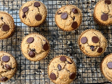 Chocolate chip cookies cooling on a wire rack.