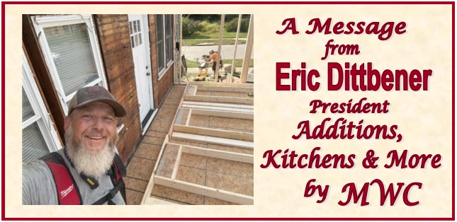 Stack of books next to pencils in a holder and a camera.