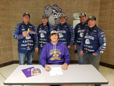 Biggtime Charlie with the Becker HIgh School Team Coaches on signing day.  Charlie committed to Univ